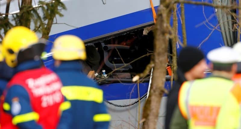 Members of emergency services work at the site of the two crashed trains near Bad Aibling in southwestern Germany, February 9, 2016. REUTERS/Michael Dalder