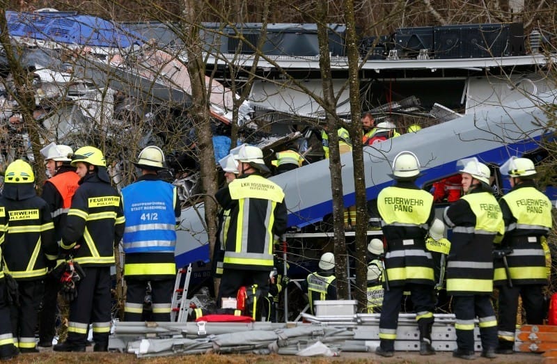 Members of emergency services work at the site of the two crashed trains near Bad Aibling in southwestern Germany, February 9, 2016. REUTERS/Michael Dalder