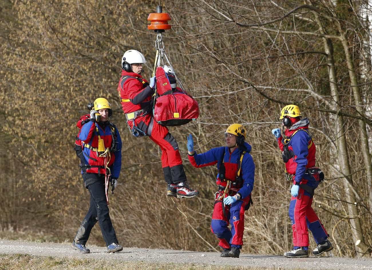 Members of emergency services prepare an injured person for transportation by helicopter from the site of the two crashed trains near Bad Aibling in southwestern Germany, February 9, 2016. REUTERS/Michael Dalder