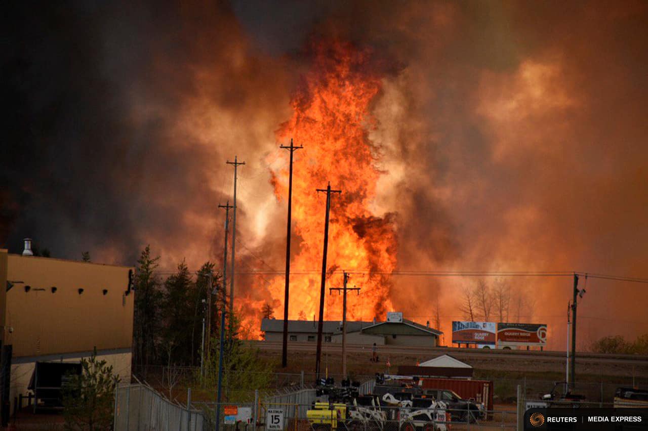 Flames rise in Industrial area south Fort McMurray, Alberta Canada May 3, 2016. Courtesy CBC News/Handout via REUTERS