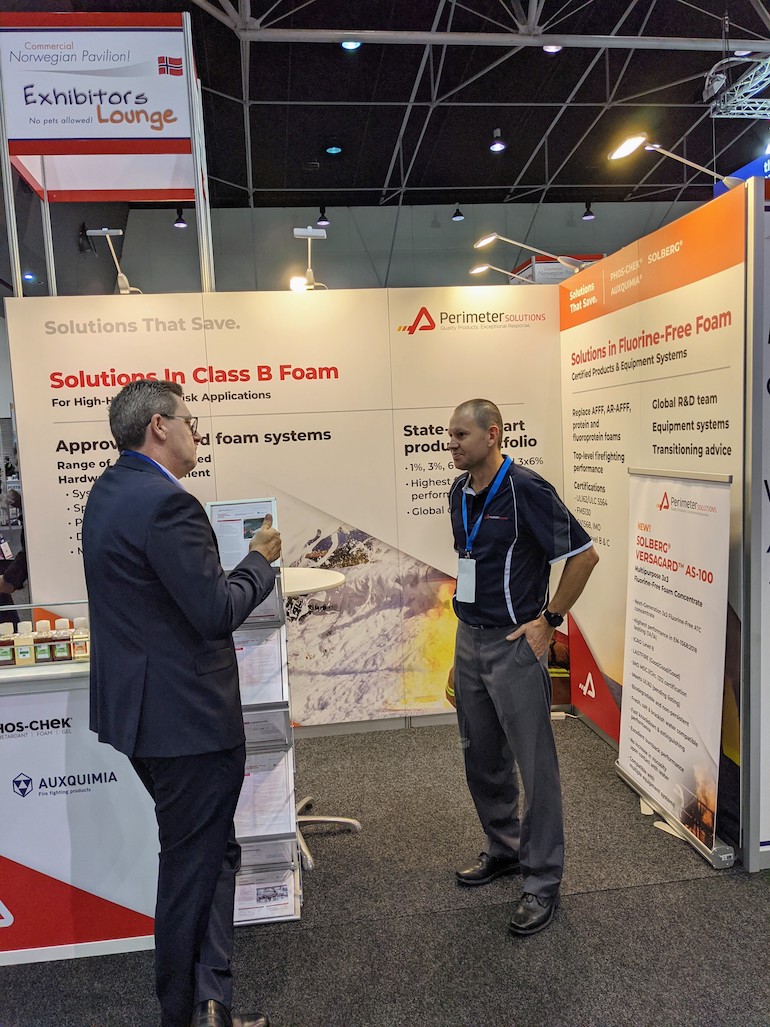 David Phoenix (R) talking to a client on the Perimeter Solutions booth at the AOG Show. (Image copyright: Perimeter Solutions)