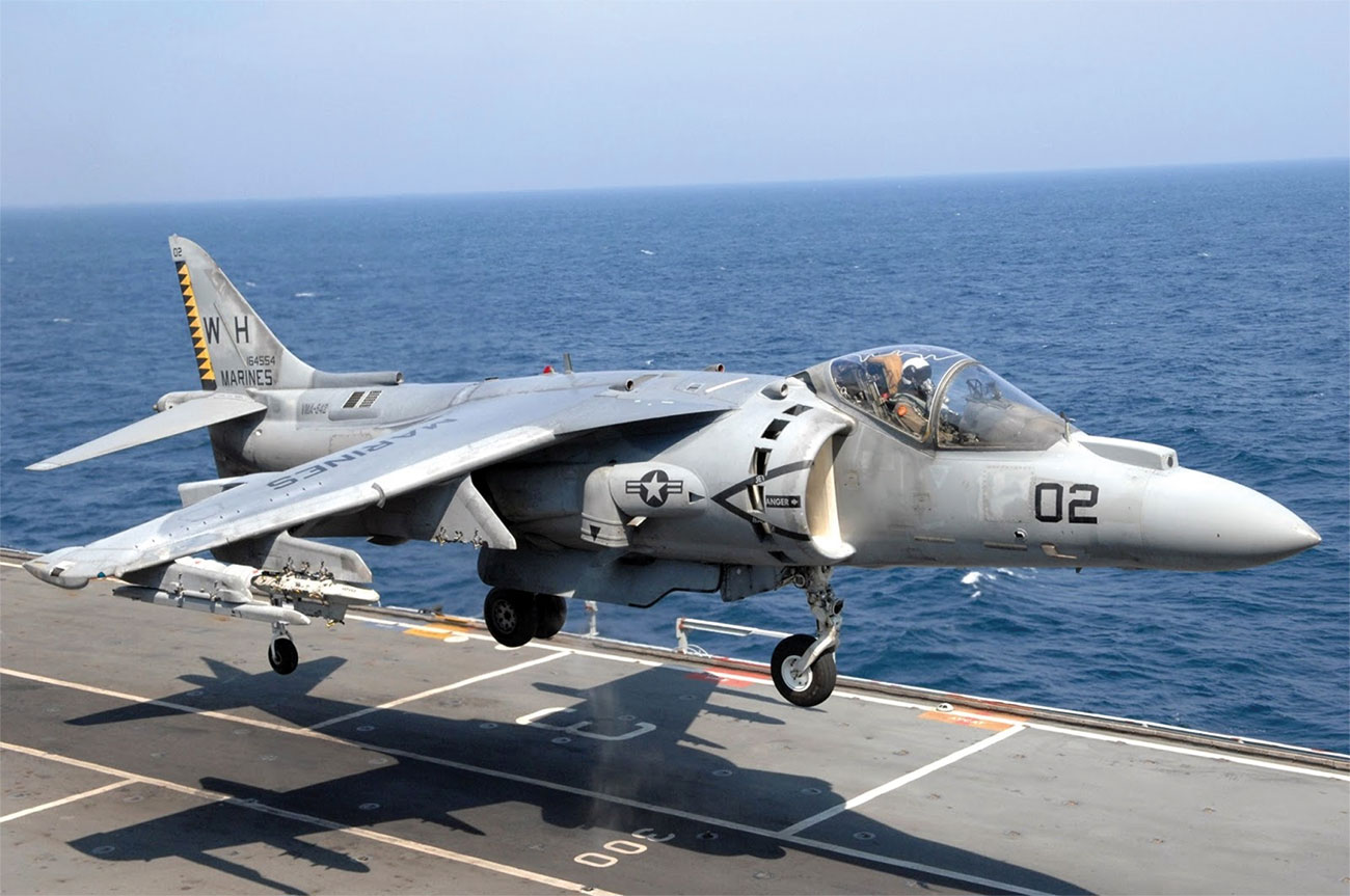 AV-8B Harrier making a VTOL landing out at sea.