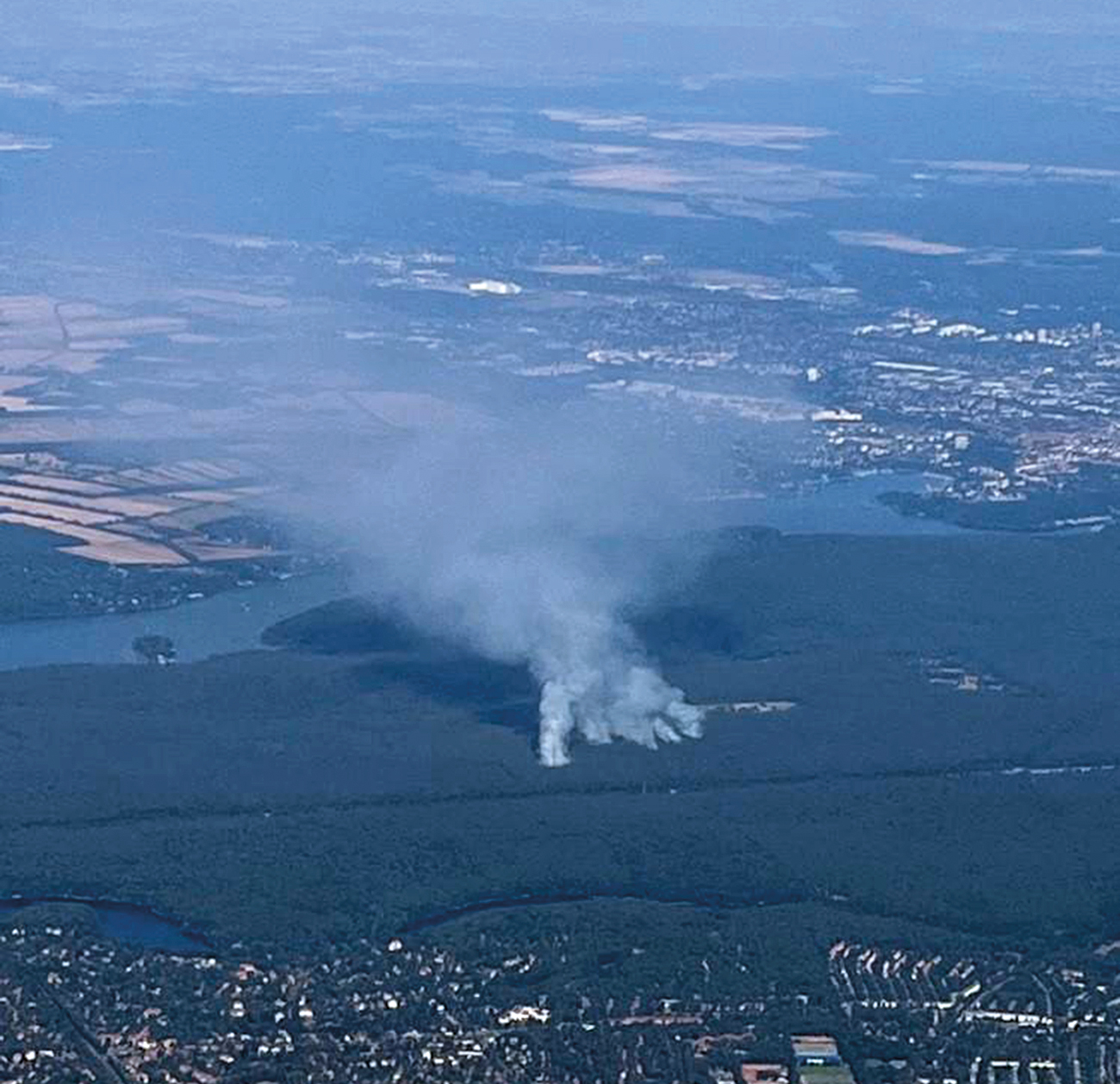 Figure 1. Aerial view of Grunewald munitions depot fire on the outskirts of Berlin, Germany (Aug 22). Facing Northwest. Image courtesy of Satellite Vu