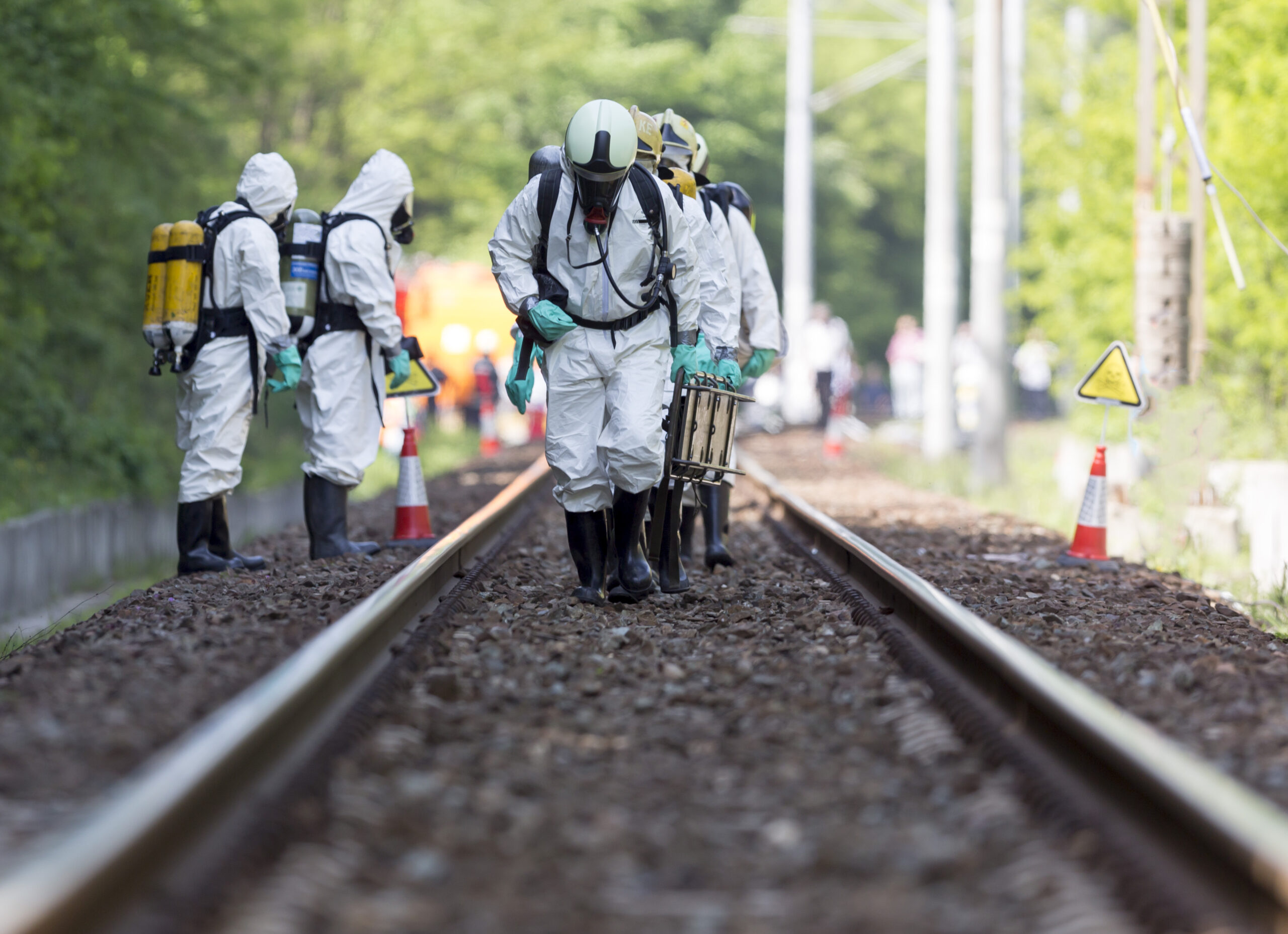 A,Team,Working,With,Toxic,Acids,And,Chemicals,Is,Approaching